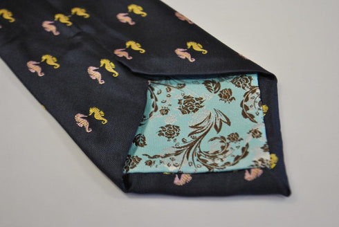navy tie with seahorse design